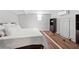 Cozy basement bedroom with a comfortable bed, sleek black furniture, and modern decor at 3595 South Nw St, Duluth, GA 30096