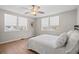 Sunlit bedroom with wood-look flooring, and neutral walls creating a serene and airy atmosphere at 3595 South Nw St, Duluth, GA 30096