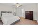 Bright bedroom with a ceiling fan, wood-look floors and ample closet space for storage solutions at 3595 South Nw St, Duluth, GA 30096