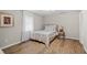 Cozy bedroom with a neutral color scheme, wood-look flooring and a serene ambiance at 3595 South Nw St, Duluth, GA 30096