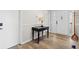 Inviting entryway with a sleek console table, complemented by wood-look flooring at 3595 South Nw St, Duluth, GA 30096