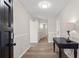 Bright entryway with wood flooring and neutral walls, leading to other rooms in the house at 3595 South Nw St, Duluth, GA 30096