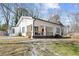 Exterior image of a light-colored home with front porch and well-maintained lawn at 3595 South Nw St, Duluth, GA 30096