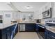 Well-lit kitchen featuring stainless appliances, granite counters, and ample storage at 3595 South Nw St, Duluth, GA 30096