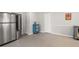 Bright pantry area featuring stainless steel refrigerator and practical storage solutions at 3595 South Nw St, Duluth, GA 30096