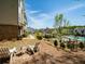 Backyard features lawn chairs with a community pool and other townhomes in the background at 3862 Firewood Ln # 110, Suwanee, GA 30024
