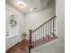 Inviting entryway with hardwood floors, staircase, and a clear view through the front door's sidelight at 3862 Firewood Ln # 110, Suwanee, GA 30024