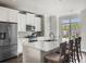 Modern kitchen with stainless steel appliances and a spacious center island at 3862 Firewood Ln # 110, Suwanee, GA 30024