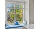 Close-up of kitchen nook with window seat and decorative pillows at 3862 Firewood Ln # 110, Suwanee, GA 30024