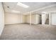 Finished basement with carpet, support beam, and stairway to the upper floors at 3995 Emerald North Dr, Decatur, GA 30035