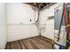 Basement area with wood-look flooring, water heater, and white-painted cinder block at 3995 Emerald North Dr, Decatur, GA 30035