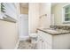 Bright bathroom featuring a granite countertop vanity and a tiled walk-in shower at 3995 Emerald North Dr, Decatur, GA 30035