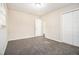 Bedroom with neutral walls, carpet flooring, and double closet doors at 3995 Emerald North Dr, Decatur, GA 30035