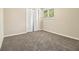 Cozy bedroom with neutral carpet, ample closet space, and a window letting in natural light at 3995 Emerald North Dr, Decatur, GA 30035