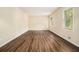 Bright living room with hardwood floors, neutral walls, and two large windows offering plenty of natural light at 3995 Emerald North Dr, Decatur, GA 30035