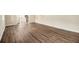 Living room showcasing wood-look flooring and ample natural light, plus stairs to the upper floor at 3995 Emerald North Dr, Decatur, GA 30035