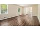 Bright living room with hardwood floors, and two large windows offering plenty of natural light at 3995 Emerald North Dr, Decatur, GA 30035