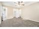 Bright main bedroom with neutral carpet, ample closet space, and an attached bathroom at 3995 Emerald North Dr, Decatur, GA 30035