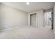 Bedroom with closet, neutral carpet, trim, and walls at 5058 Meadow Ne Ln, Marietta, GA 30068