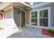 Inviting front entrance with a green door and manicured flowerbeds at 5058 Meadow Ne Ln, Marietta, GA 30068