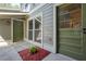 Welcoming front entryway featuring olive-colored doors and a mulched flower bed at 5058 Meadow Ne Ln, Marietta, GA 30068
