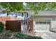 Charming townhouse featuring a garage, fenced courtyard, and lovely landscaping at 5058 Meadow Ne Ln, Marietta, GA 30068