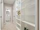 Hallway with built-in shelving and a view into the bathroom at 5058 Meadow Ne Ln, Marietta, GA 30068