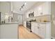 Modern kitchen featuring white cabinets, stainless steel appliances, and granite countertops at 5058 Meadow Ne Ln, Marietta, GA 30068