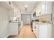 Updated kitchen features white cabinets, granite counters, subway tile backsplash and stainless appliances at 5058 Meadow Ne Ln, Marietta, GA 30068
