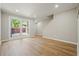 Bright living room featuring hardwood floors and a staircase at 5058 Meadow Ne Ln, Marietta, GA 30068