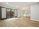Open living room with built-in shelves, wood floors, and large doors to the exterior at 5058 Meadow Ne Ln, Marietta, GA 30068