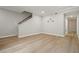 Spacious living room featuring hardwood floors, a staircase, and neutral colors at 5058 Meadow Ne Ln, Marietta, GA 30068