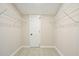 Walk-in closet with white wire shelving and tile floors at 5058 Meadow Ne Ln, Marietta, GA 30068