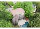 Aerial view of backyard with pool, deck and mature trees at 770 Pine Leaf Ct, Alpharetta, GA 30022