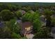 Aerial view of a home nestled among lush greenery in a quiet, residential neighborhood at 770 Pine Leaf Ct, Alpharetta, GA 30022