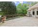 A large, wood back deck overlooking the trees, backyard and pool area at 770 Pine Leaf Ct, Alpharetta, GA 30022