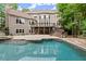 Spacious backyard featuring an in-ground pool and lush landscaping perfect for outdoor living and relaxation at 770 Pine Leaf Ct, Alpharetta, GA 30022