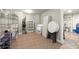 Unfinished basement area ideal for storage with shelving, folding chairs, and tables at 770 Pine Leaf Ct, Alpharetta, GA 30022