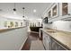 Open concept basement bar area with granite countertops and hardwood flooring at 770 Pine Leaf Ct, Alpharetta, GA 30022