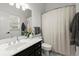 Bathroom featuring vanity with mirror, modern fixtures, and shower with curtain at 770 Pine Leaf Ct, Alpharetta, GA 30022