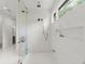 Glass enclosed shower featuring marble tile, bronze hardware, and a built-in soap niche at 770 Pine Leaf Ct, Alpharetta, GA 30022