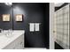 Bathroom with modern vanity, Georgia-themed artwork, and a shower/tub with a shower curtain at 770 Pine Leaf Ct, Alpharetta, GA 30022
