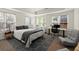 Bedroom featuring natural light, neutral walls, carpet, a bed, and a workspace at 770 Pine Leaf Ct, Alpharetta, GA 30022
