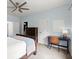 Bedroom features a ceiling fan, desk, and a comfortable bed at 770 Pine Leaf Ct, Alpharetta, GA 30022