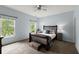 Bedroom featuring blue walls, carpet, and large window at 770 Pine Leaf Ct, Alpharetta, GA 30022