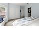 Spacious bedroom with a window seat, view of the backyard, and a nearby en suite bathroom at 770 Pine Leaf Ct, Alpharetta, GA 30022