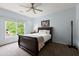 Cozy bedroom with large window, a ceiling fan and carpet at 770 Pine Leaf Ct, Alpharetta, GA 30022
