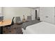 Bedroom with a bed, desk, and lounge chairs that is accessible to an exit at 770 Pine Leaf Ct, Alpharetta, GA 30022