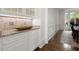 Dining area with a view, custom cabinets and millwork, plus granite countertops at 770 Pine Leaf Ct, Alpharetta, GA 30022