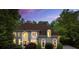 Handsome two-story home with a manicured lawn and mature landscaping at 770 Pine Leaf Ct, Alpharetta, GA 30022